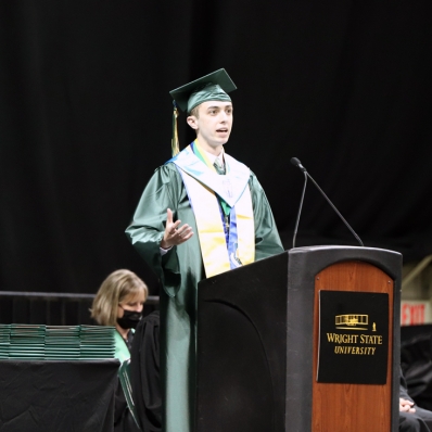 student speaking at lectern